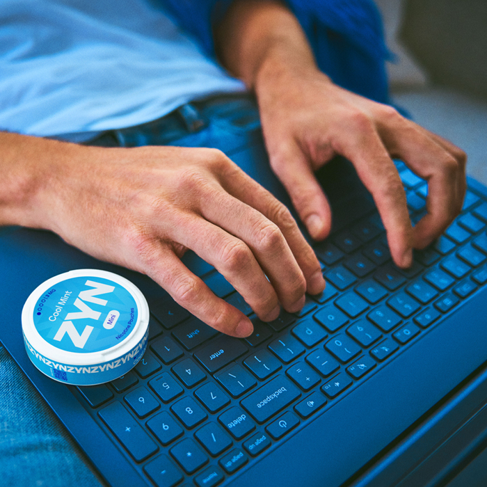 Man typing on the laptop, ilustration of what is ZYN news