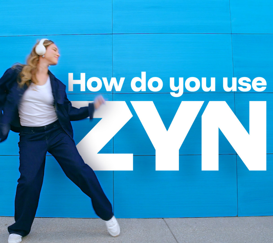 ZYN COOL MINT - an open, light blue nicotine pouch can with 2 pouches next to it