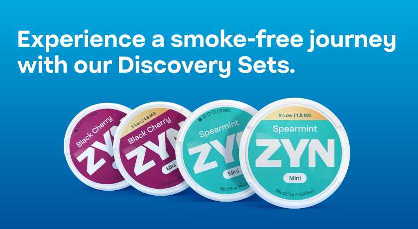 Four closed ZYN nicotine pouch cans (Blackcherry Mini X-Low, Blackcherry Mini 3 mg, Spearmint Mini X-Low, Spearmint Mini 3mg)